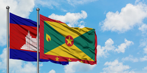 Cambodia and Grenada flag waving in the wind against white cloudy blue sky together. Diplomacy concept, international relations.