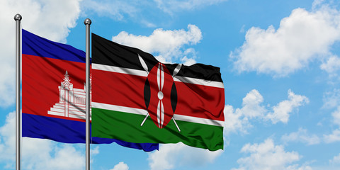 Cambodia and Kenya flag waving in the wind against white cloudy blue sky together. Diplomacy concept, international relations.