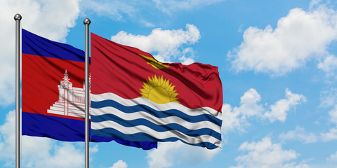 Cambodia and Kiribati flag waving in the wind against white cloudy blue sky together. Diplomacy concept, international relations.