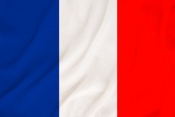 national flag of the country france on gentle silk with wind folds, travel concept, immigration, politics, copy space, close-up