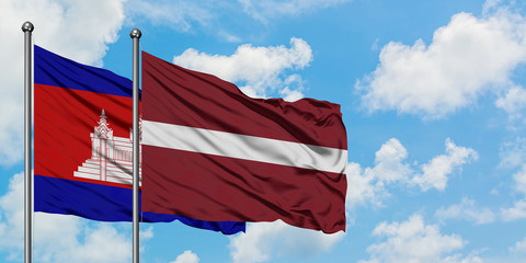 Cambodia and Latvia flag waving in the wind against white cloudy blue sky together. Diplomacy concept, international relations.