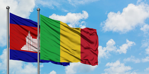 Cambodia and Mali flag waving in the wind against white cloudy blue sky together. Diplomacy concept, international relations.