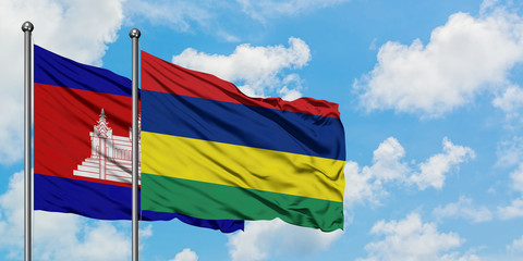 Cambodia and Mauritius flag waving in the wind against white cloudy blue sky together. Diplomacy concept, international relations.