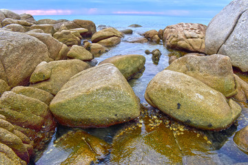 Aerial view of ocean waves and beautiful rocky coast at Rayong sea, Thailand
