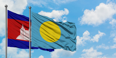 Cambodia and Palau flag waving in the wind against white cloudy blue sky together. Diplomacy concept, international relations.