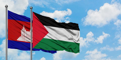 Cambodia and Palestine flag waving in the wind against white cloudy blue sky together. Diplomacy concept, international relations.