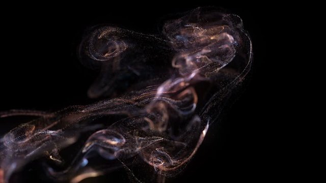 4k. Fluid abstract. Slow motion.  Liquid glowing neon particles. Particle cloud. Black backround. 3840x2160
