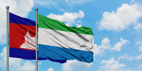 Cambodia and Sierra Leone flag waving in the wind against white cloudy blue sky together. Diplomacy concept, international relations.