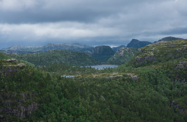 Mountains on the way to the Preachers Pulpit Rock in fjord Lysefjord - Norway - nature and travel background. Lake Tjodnane, july 2019