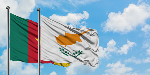 Cameroon and Cyprus flag waving in the wind against white cloudy blue sky together. Diplomacy concept, international relations.