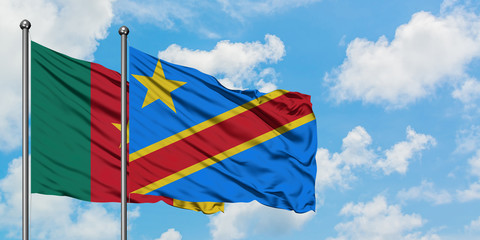 Cameroon and Congo flag waving in the wind against white cloudy blue sky together. Diplomacy concept, international relations.