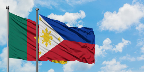 Cameroon and Philippines flag waving in the wind against white cloudy blue sky together. Diplomacy concept, international relations.