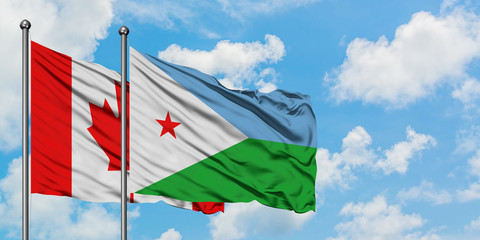 Canada and Djibouti flag waving in the wind against white cloudy blue sky together. Diplomacy concept, international relations.