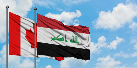 Canada and Iraq flag waving in the wind against white cloudy blue sky together. Diplomacy concept, international relations.