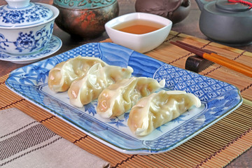 Chinese dumplings or Jiaozi. Japanese dumpling or Gyoza. Famous Asian cuisine for family day and New year.