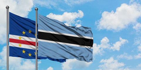 Cape Verde and Botswana flag waving in the wind against white cloudy blue sky together. Diplomacy concept, international relations.
