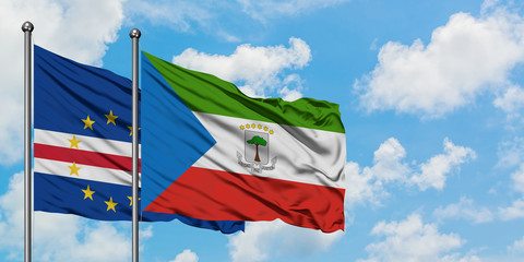 Cape Verde and Equatorial Guinea flag waving in the wind against white cloudy blue sky together. Diplomacy concept, international relations.