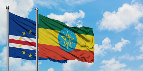 Cape Verde and Ethiopia flag waving in the wind against white cloudy blue sky together. Diplomacy concept, international relations.