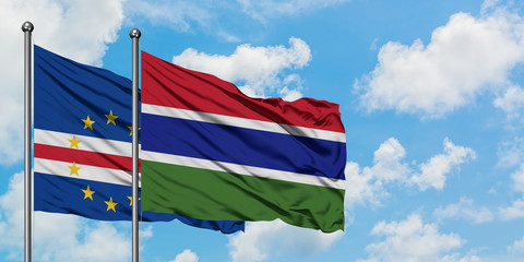 Cape Verde and Gambia flag waving in the wind against white cloudy blue sky together. Diplomacy concept, international relations.