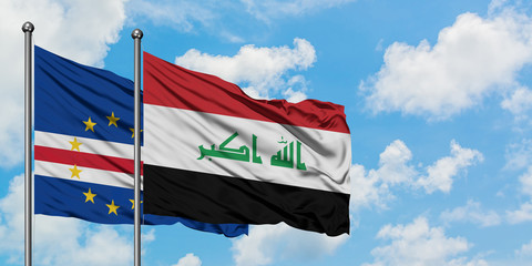 Cape Verde and Iraq flag waving in the wind against white cloudy blue sky together. Diplomacy concept, international relations.