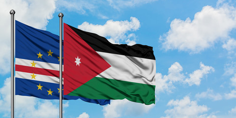 Cape Verde and Jordan flag waving in the wind against white cloudy blue sky together. Diplomacy concept, international relations.