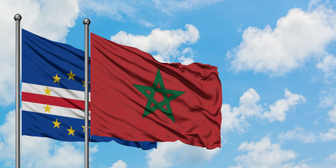 Cape Verde and Morocco flag waving in the wind against white cloudy blue sky together. Diplomacy concept, international relations.