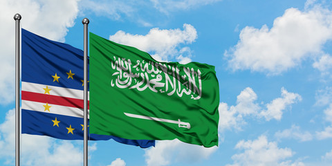 Cape Verde and Saudi Arabia flag waving in the wind against white cloudy blue sky together. Diplomacy concept, international relations.