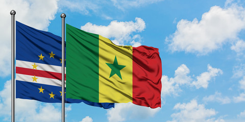 Cape Verde and Senegal flag waving in the wind against white cloudy blue sky together. Diplomacy concept, international relations.