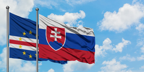 Cape Verde and Slovakia flag waving in the wind against white cloudy blue sky together. Diplomacy concept, international relations.