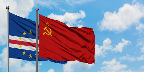 Cape Verde and Soviet Union flag waving in the wind against white cloudy blue sky together. Diplomacy concept, international relations.