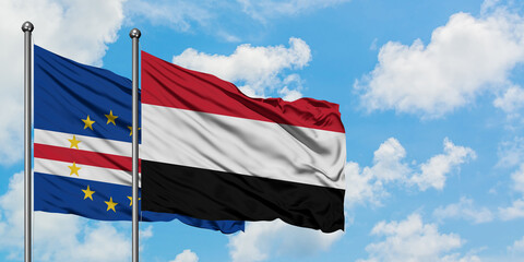 Cape Verde and Yemen flag waving in the wind against white cloudy blue sky together. Diplomacy concept, international relations.