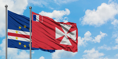 Cape Verde and Wallis And Futuna flag waving in the wind against white cloudy blue sky together. Diplomacy concept, international relations.