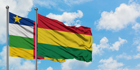 Central African Republic and Bolivia flag waving in the wind against white cloudy blue sky together. Diplomacy concept, international relations.