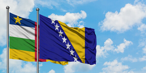 Central African Republic and Bosnia Herzegovina flag waving in the wind against white cloudy blue sky together. Diplomacy concept, international relations.