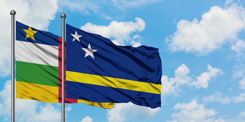 Central African Republic and Curacao flag waving in the wind against white cloudy blue sky together. Diplomacy concept, international relations.