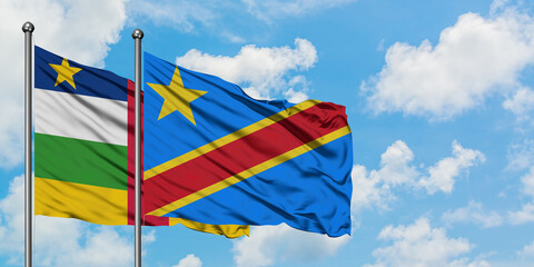 Central African Republic and Congo flag waving in the wind against white cloudy blue sky together. Diplomacy concept, international relations.