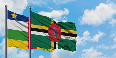 Central African Republic and Dominica flag waving in the wind against white cloudy blue sky together. Diplomacy concept, international relations.
