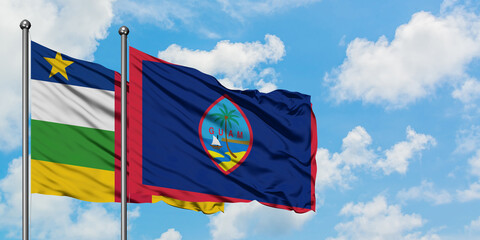 Central African Republic and Guam flag waving in the wind against white cloudy blue sky together. Diplomacy concept, international relations.