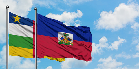 Central African Republic and Haiti flag waving in the wind against white cloudy blue sky together. Diplomacy concept, international relations.