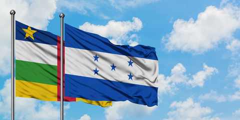 Central African Republic and Honduras flag waving in the wind against white cloudy blue sky together. Diplomacy concept, international relations.
