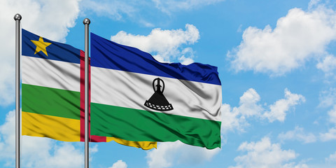 Central African Republic and Lesotho flag waving in the wind against white cloudy blue sky together. Diplomacy concept, international relations.