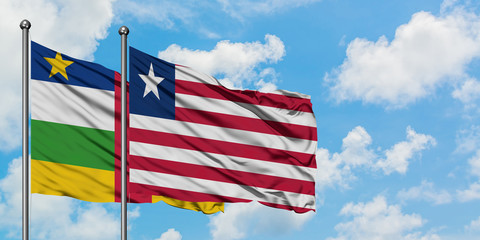 Central African Republic and Liberia flag waving in the wind against white cloudy blue sky together. Diplomacy concept, international relations.