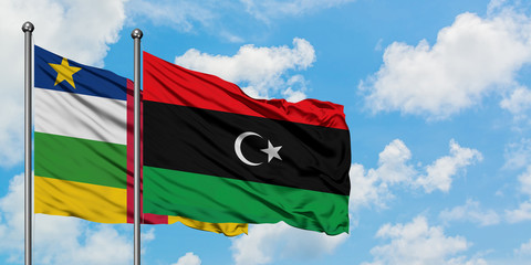 Central African Republic and Libya flag waving in the wind against white cloudy blue sky together. Diplomacy concept, international relations.