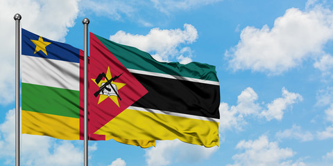 Central African Republic and Mozambique flag waving in the wind against white cloudy blue sky together. Diplomacy concept, international relations.