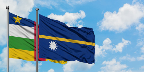 Central African Republic and Nauru flag waving in the wind against white cloudy blue sky together. Diplomacy concept, international relations.