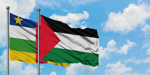 Central African Republic and Palestine flag waving in the wind against white cloudy blue sky together. Diplomacy concept, international relations.