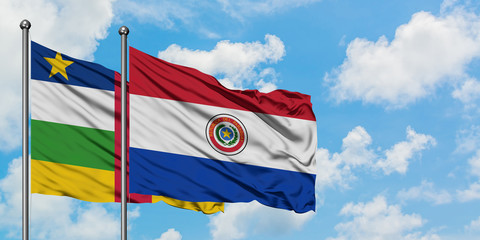 Central African Republic and Paraguay flag waving in the wind against white cloudy blue sky together. Diplomacy concept, international relations.