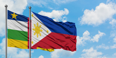 Central African Republic and Philippines flag waving in the wind against white cloudy blue sky together. Diplomacy concept, international relations.