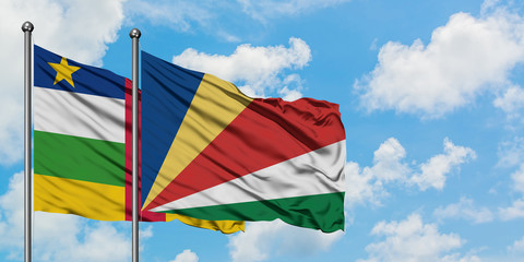 Central African Republic and Seychelles flag waving in the wind against white cloudy blue sky together. Diplomacy concept, international relations.