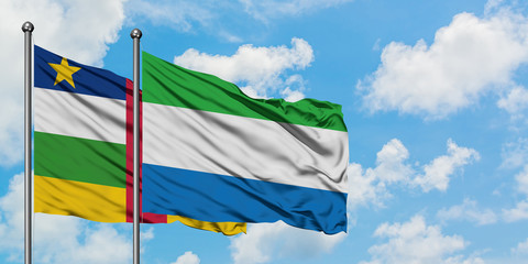 Central African Republic and Sierra Leone flag waving in the wind against white cloudy blue sky together. Diplomacy concept, international relations.